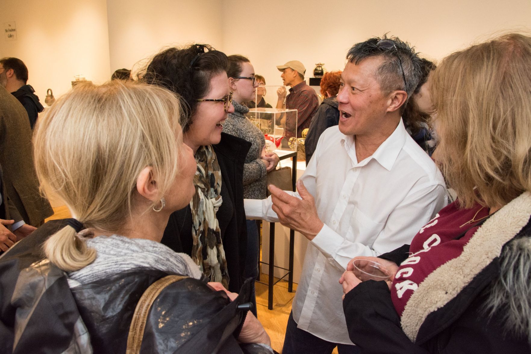Guests mingle and chat with the artists